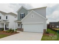 Charming two-story home with gray siding, a two-car garage, and a well-maintained lawn in a desirable community at 1278 Langston Ln, Salisbury, NC 28144
