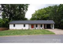 Charming single-story home featuring a bright red front door and well-maintained front yard at 1537 Spangler Dr, Shelby, NC 28150