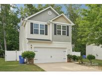 Charming two-story home with a white garage door, black shutters, and a well-manicured lawn at 1835 Allegheny Dr, Gastonia, NC 28054