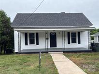 Charming single-story home with a covered front porch and a well-maintained lawn at 103 Meadow Ne Ave # 6, Concord, NC 28025