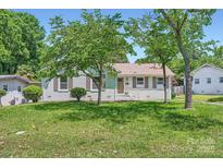 Charming single-story home with a well-maintained lawn and inviting curb appeal at 1515 Edgewater Dr, Charlotte, NC 28210