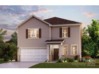 Charming two-story home with a well-manicured lawn and welcoming facade; a perfect place to call home at 710 Olde England Dr, Lincolnton, NC 28092