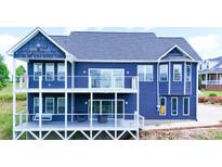 Stunning blue home with multiple decks offering outdoor living and entertaining spaces at 7768 Pinecone Ln, Hickory, NC 28602