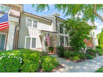 Inviting home featuring a charming exterior, American flag, and well-manicured landscaping at 815 Jetton St, Davidson, NC 28036