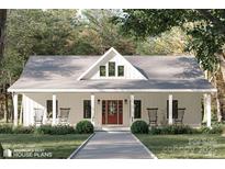 Charming home featuring board and batten siding, a welcoming front porch, and inviting rocking chairs at 1821 Country Club Rd, Wadesboro, NC 28170