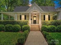 Charming craftsman home with a covered front porch and well-manicured landscaping at 1915 Winthrop Ave, Charlotte, NC 28203