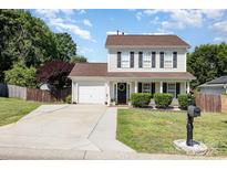 Charming two-story home featuring a well-manicured lawn, attached garage, and inviting front porch at 197 Devon Forest Dr, Mooresville, NC 28115