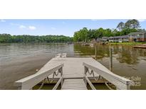 Beautiful view from the lake dock, complete with seating for relaxation by the water at 235 Pebble Point Rd, Salisbury, NC 28146