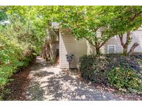 View of the exterior featuring a welcoming pathway and beautifully maintained landscaping at 415 W 7Th St # F, Charlotte, NC 28202