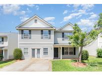 Charming two-story home with light siding, black shutters, and a well-manicured front lawn at 5141 Grays Ridge Dr, Charlotte, NC 28269