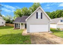 Charming home with a two-car garage and a well-maintained lawn at 7321 Mapleridge Dr, Charlotte, NC 28210