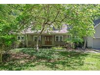 Charming home with a covered front porch and a beautiful, landscaped front yard at 188 Stonemarker Rd, Mooresville, NC 28117