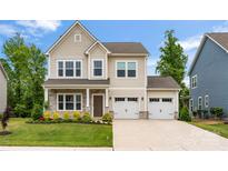 Charming two-story home with a two-car garage and a beautifully landscaped front yard at 1918 Thoreau Way, York, SC 29745