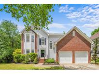 Charming two-story home with a well-manicured lawn, two car garage, and welcoming front entrance at 8709 Huntland Ct, Charlotte, NC 28277