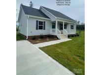 Charming single-story home with a welcoming front porch and well-manicured lawn at 1669 California Rd, York, SC 29745