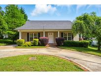 Well-manicured front yard and exterior view of this charming one story home at 42 Linford St, Belmont, NC 28012
