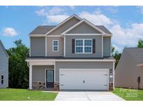 Charming two-story home with a two-car garage and well-maintained lawn at 1512 Doran Ter, Richburg, SC 29729