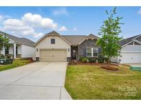 Charming single-Gathering home with well-maintained lawn and a two-car garage at 1825 Lotus Ln, Denver, NC 28037