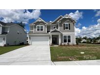 Charming two-story home featuring a manicured lawn and a spacious two-car garage, perfect for comfortable living at 2046 Sabra St # Cwo0006, Gastonia, NC 28054