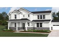 Charming two-story home with stone accents, covered front porch, and manicured lawn at 2517 Mabel Ln, Monroe, NC 28110