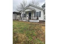 Charming single-story home featuring a quaint front porch and well-maintained lawn at 843 Spring St, Rock Hill, SC 29730