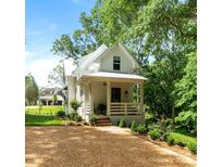 Charming two-story home with a welcoming front porch and well-manicured landscaping at 2268 New Gray Rock Rd, Fort Mill, SC 29708
