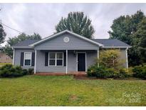 Charming single-story home featuring a well-maintained lawn and classic architectural details at 290 Greentree Dr, Rock Hill, SC 29730