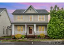 Charming two-story home with a welcoming front porch and well-maintained landscaping at 3906 Balsam St, Indian Trail, NC 28079
