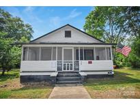 Charming home featuring a screened porch, offering a cozy and inviting outdoor living space at 514 S Martin St, Shelby, NC 28150