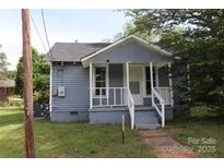 Charming single story home with a front porch and well-maintained exterior, perfect for starter home at 614 Goldsboro Ave, Statesville, NC 28677