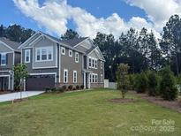Charming two-story home with a well-manicured lawn and inviting curb appeal at 292 Laura Elizabeth Ln, Clover, SC 29710