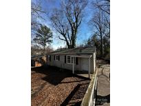 Charming single-story home with a covered porch and a pathway through the front yard at 722 S Weldon St, Gastonia, NC 28052