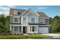 Charming two-story home with stone accents, gray siding, and a well-manicured front lawn at 162 Nicholson Ln, Mooresville, NC 28115