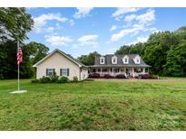 Sprawling home and detached garage with beautiful green lawn and landscaping at 2451 Reepsville Rd, Lincolnton, NC 28092