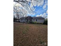 Charming single-story home with a cozy front porch and a spacious front yard at 29386 Nelson Mountain Rd, Albemarle, NC 28001