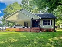 Charming single Gathering home with a well maintained lawn and large carport at 312 Shady Ln, Lincolnton, NC 28092