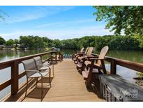 Private dock on the lake featuring a seating area and stunning water views at 408 Emerald Bay Dr, Salisbury, NC 28146
