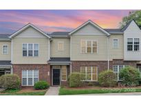 Charming townhome featuring a brick and vinyl exterior with well-maintained landscaping at 4368 Yoruk Forest Ln, Charlotte, NC 28211
