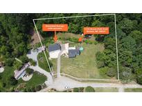 Expansive aerial view of property featuring a home with a pool, a detached garage, and ample land at 1135 Brook Path Trl, Denver, NC 28037