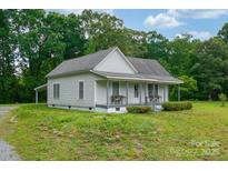 Charming home featuring a covered front porch, and lush greenery at 2126 Robby Dr, Maiden, NC 28650