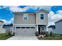 Charming two-story home featuring a two-car garage and lovely curb appeal at 815 Blue Canyon Dr, York, SC 29745