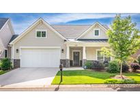 Charming home with a manicured lawn, two car garage, and inviting front porch at 1109 Bunch Dr, Statesville, NC 28677