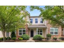 Charming brick and siding townhome with manicured landscaping in a desirable neighborhood at 206 Overstone Ct, Fort Mill, SC 29715