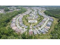 This is an aerial view of a home in a residential neighborhood with tree lined streets, and well maintained landscaping at 4975 Looking Glass Trl, Denver, NC 28037