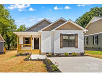 Charming single-story home with a welcoming porch and well-manicured landscaping in a vibrant community at 626 W Bell St, Statesville, NC 28677