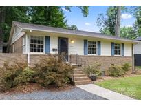 Charming single-story home featuring brick accents, a well-maintained yard, and inviting curb appeal at 3900 Langley Rd, Charlotte, NC 28215