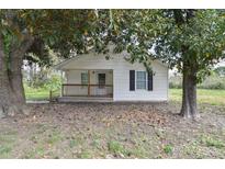 Charming home featuring a covered front porch and a well-maintained white exterior at 6124 Old Mt Holly Rd, Charlotte, NC 28208
