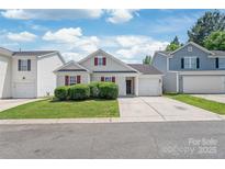 Charming single-Gathering home featuring a one-car garage and manicured landscaping at 13408 Golden Apple Ct, Charlotte, NC 28215