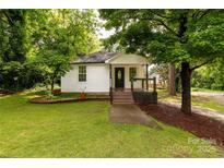 Charming single-story home featuring a cozy front porch and a well-maintained, tree-lined yard at 315 Rivers St, Rock Hill, SC 29730