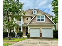Charming two-story home with a well-manicured lawn and a two-car garage at 3678 Privette Rd # 349, Matthews, NC 28104